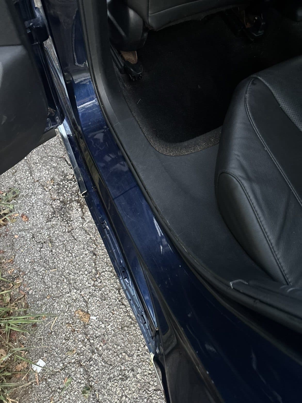Clean sedan interior door sill after detailing