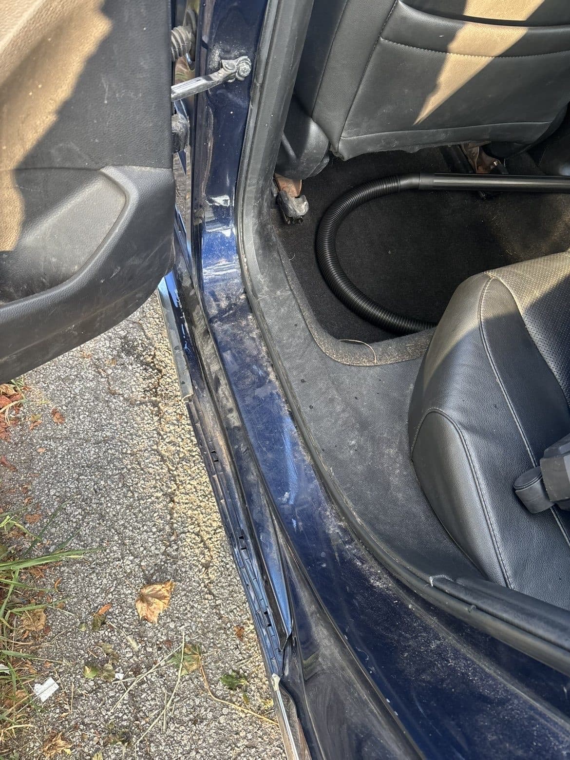 Dusty sedan interior door sill before detailing